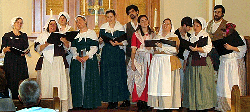 Colonial Revelers singing in a church.