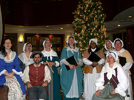 Colonial Revelers add a festive note to holiday celebrations.